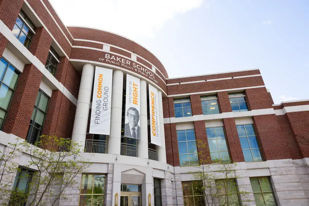 A photo of the exterior of the Baker School of Public Policy & Public Affairs during a sunny spring day
