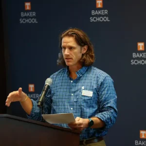 Charles B. Sims talking behind a podium