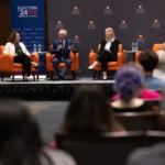 Suzzane Maloney, Bob Corker, and Krista Wiegand participate in a fireside chat at the University of Tennessee.