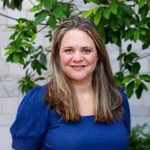 Headshot of Tara Bryan outside of the Baker School.
